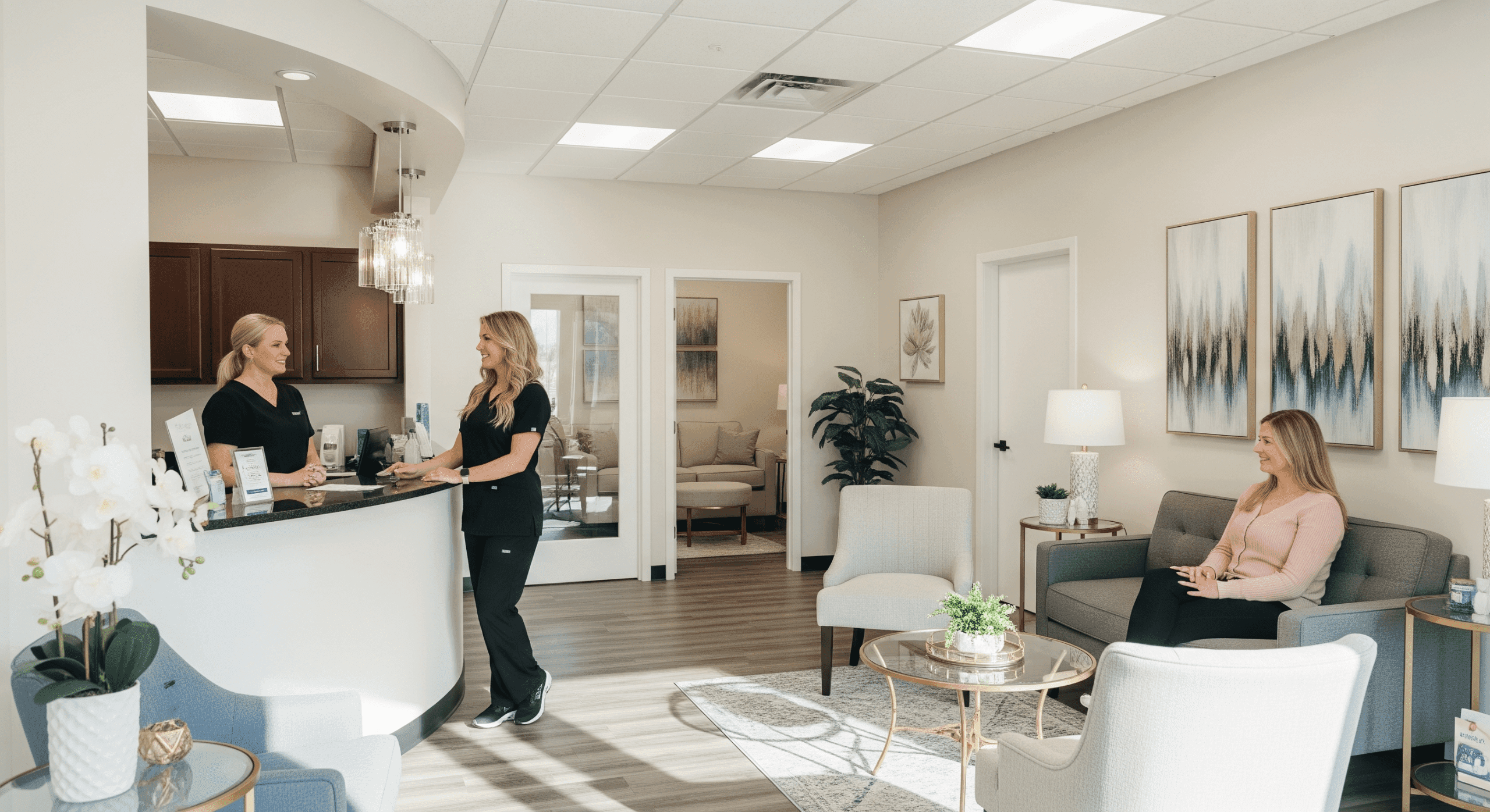 modern medical spa reception area with staff and patient seating.